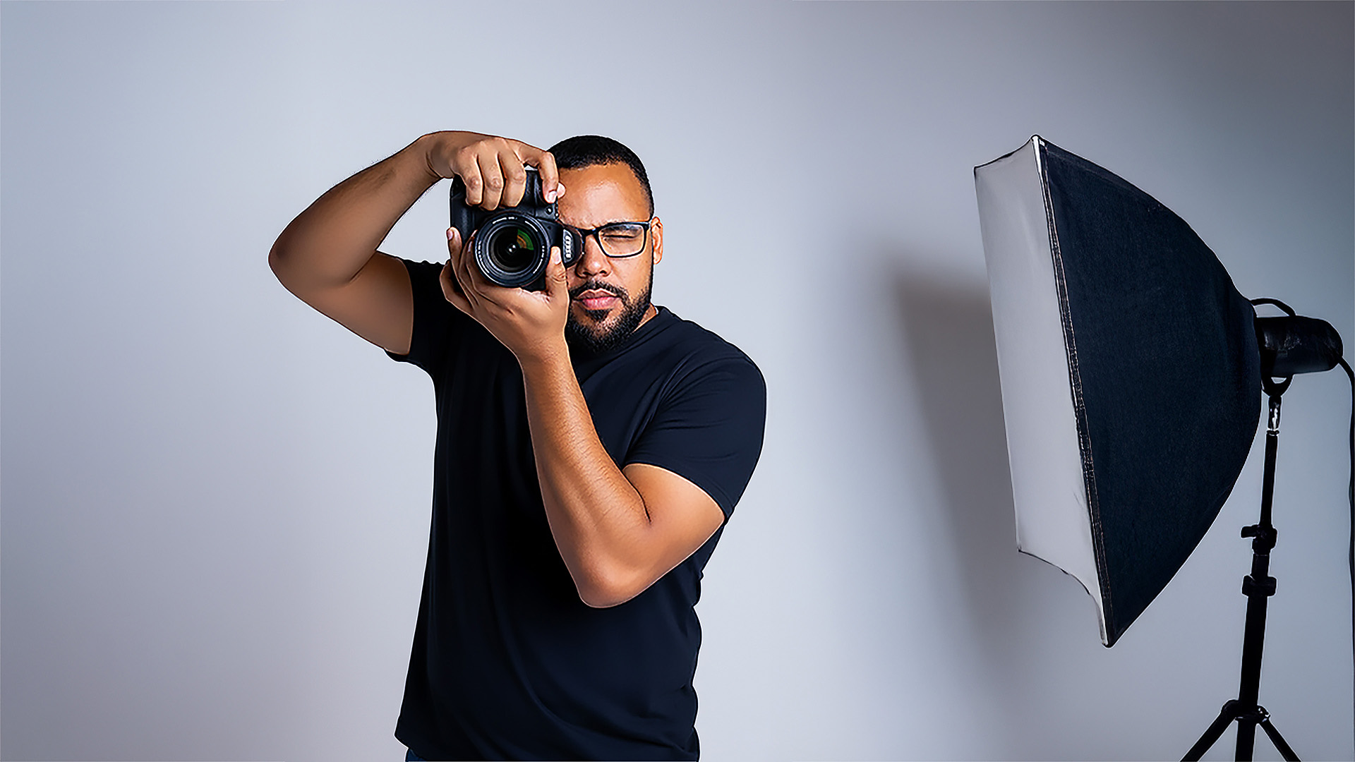 Jeff Duran Photography - Professional photographer with camera in studio